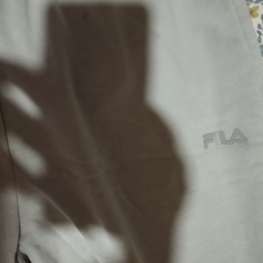 Fila Grey Sweatpants Joggers Size L (Category: Other Bottoms) located in Manila. Submitted by lene48 (Listing ID 1465471485, Image 3). Description: - Brand: Fila - Color: Grey - Size: US/F Large, UK Large, D 40 - Origin: Made in Vietnam - Features: Elastic waistband, cuffed ankles, and small dotted Fila logo on the left thigh - Fit: Relaxed fit - Condition: Great basic piece, super comfortable for lounging or workouts.