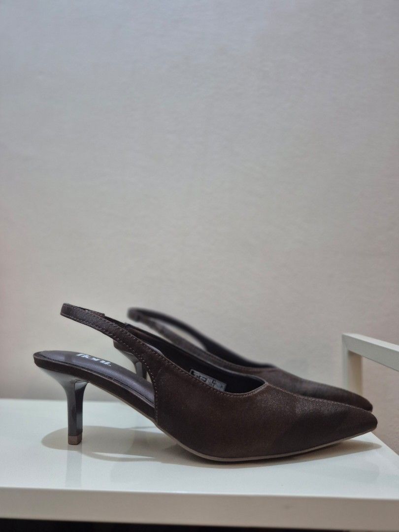 Fioni Dark Brown Slingback Kitten Heels (Category: Heels) located in Valenzuela. Submitted by connnichiwaaa (Listing ID 1465463576, Image 3). Description: - Brand: Fioni - Color: Versatile dark brown - Style: Pointed toe slingback kitten heels - Comfort: Padded insole and garterized strap for easy wear - Design: Sleek slim heel - Pairability: Neutral tone matches practically any outfit - Condition: Never worn for walking. Sinukat lang. - RFS: di 