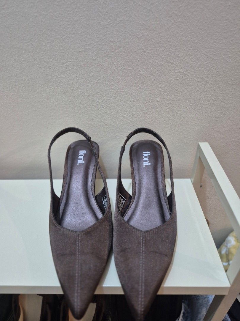 Fioni Dark Brown Slingback Kitten Heels (Category: Heels) located in Valenzuela. Submitted by connnichiwaaa (Listing ID 1465463576, Image 2). Description: - Brand: Fioni - Color: Versatile dark brown - Style: Pointed toe slingback kitten heels - Comfort: Padded insole and garterized strap for easy wear - Design: Sleek slim heel - Pairability: Neutral tone matches practically any outfit - Condition: Never worn for walking. Sinukat lang. - RFS: di 