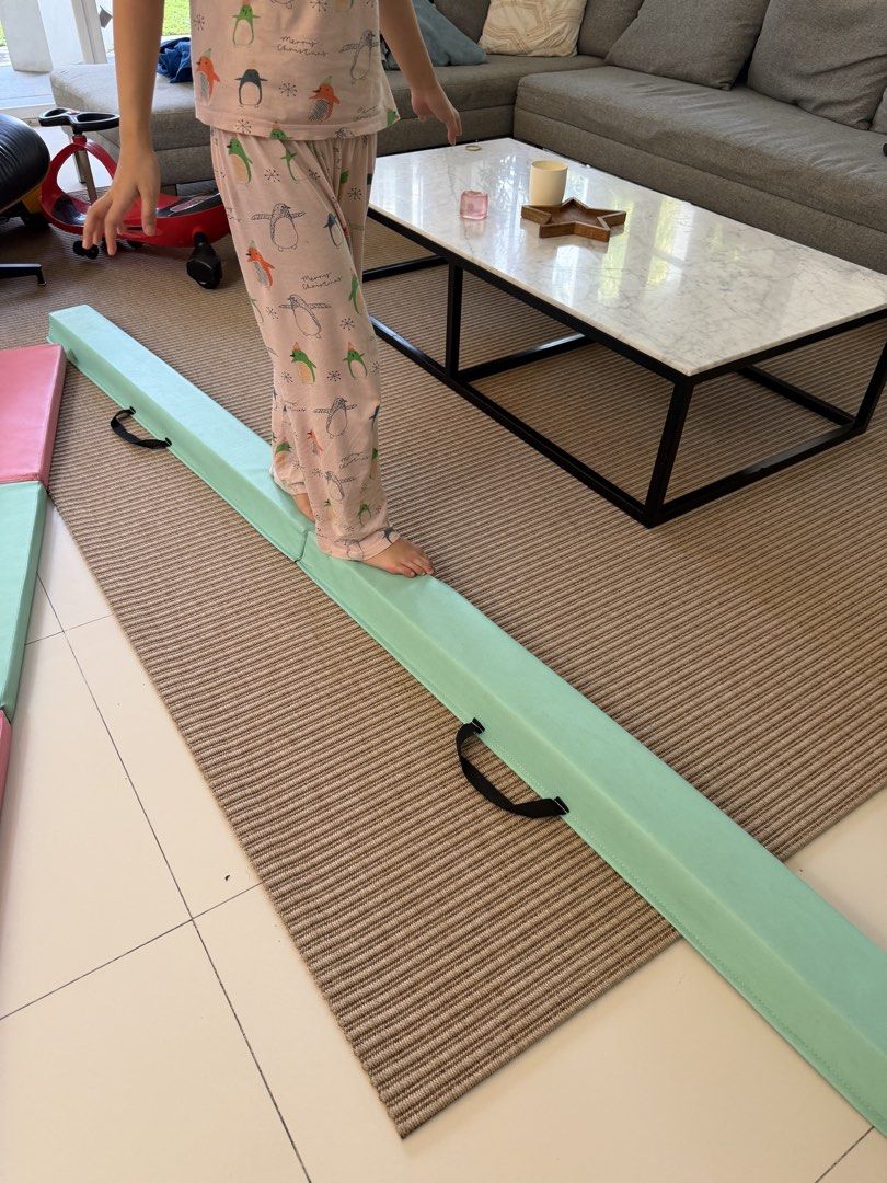 Foldable gymnastics balance beam in mint green (Category: Toning & Stretching Accessories) located in Quezon City. Submitted by mnxcabugs (Listing ID 1465394161, Image 1). Description: - Color: Mint green with black carrying handles - Material: Sturdy, supportive foam with a comfortable padded surface - Design: Sits flat on the floor for safety during practice - Convenience: Folds in the middle for quick and easy storage - Ideal For: Kids practic
