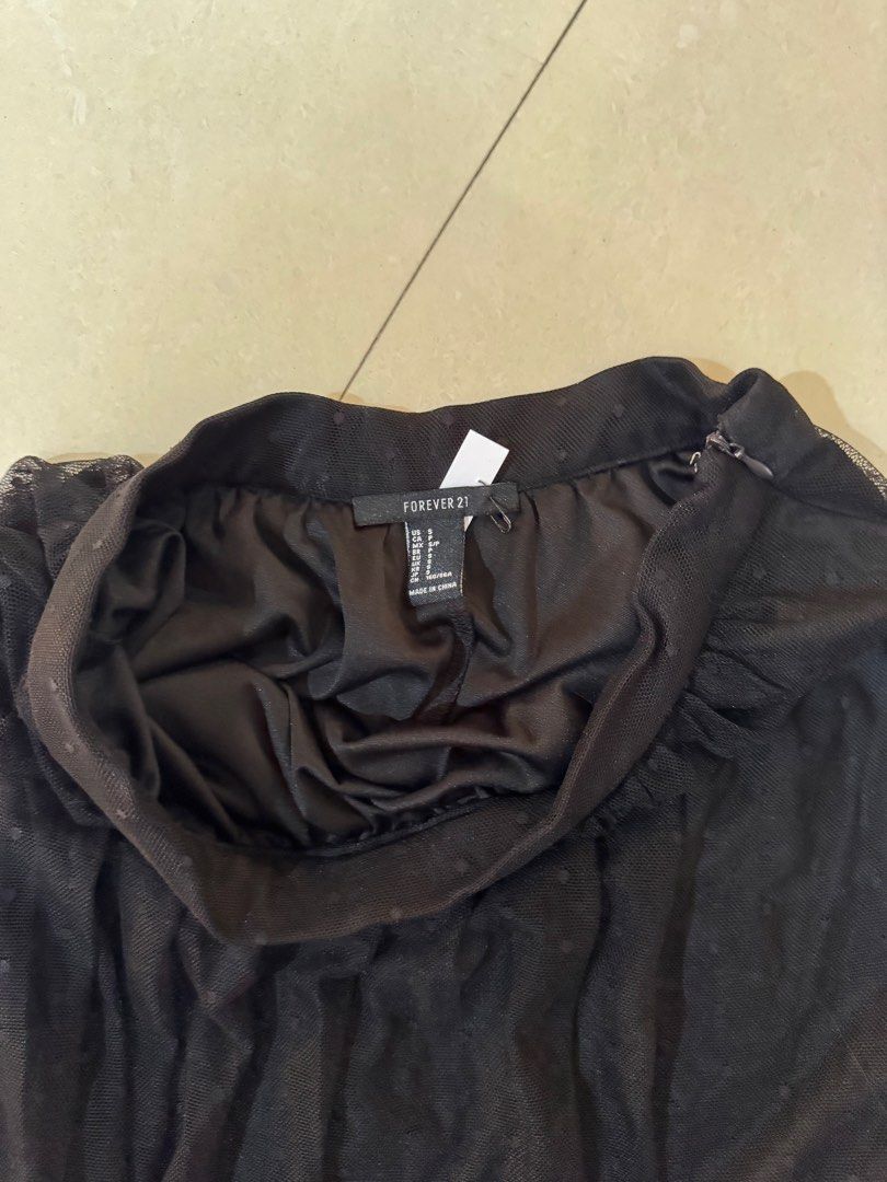 Forever 21 Black Polka Dot Mesh Midi Skirt (Category: Skirts) located in Quezon City. Submitted by sweetlyluxe (Listing ID 1465486151, Image 3). Description: - Brand: Forever 21, F21 - Condition: used 2-3x - Color: Classic black - Design: Sheer mesh overlay with cute dotted pattern and solid inner lining - Closure: Hidden side zipper - Fabric: Lightweight and comfortable - Styling: Great length to pair with boots or heels.