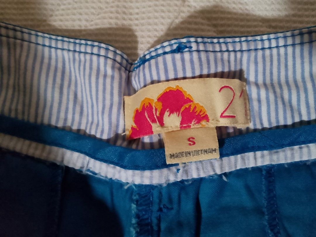 Forever 21 Blue Casual Shorts Size S (Category: Shorts) located in Aroroy. Submitted by itsyviii (Listing ID 1465524332, Image 3). Description: - Brand: Forever 21 - Size: S - Color: Bright blue - Material: Lightweight, perfect for warm weather - Features: Cuffed hem, blue-and-white striped inner waistband, front button closure with belt loops, two back pockets - Origin: Made in Vietnam.