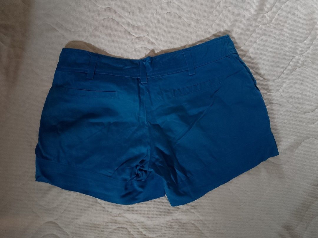 Forever 21 Blue Casual Shorts Size S (Category: Shorts) located in Aroroy. Submitted by itsyviii (Listing ID 1465524332, Image 2). Description: - Brand: Forever 21 - Size: S - Color: Bright blue - Material: Lightweight, perfect for warm weather - Features: Cuffed hem, blue-and-white striped inner waistband, front button closure with belt loops, two back pockets - Origin: Made in Vietnam.