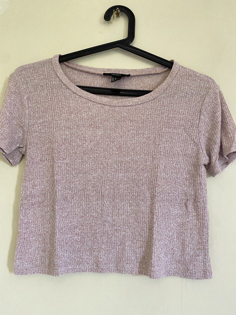 Forever 21 Pink Heathered Ribbed Crop Top (Category: Sleeveless) located in Quezon City. Submitted by abssnf (Listing ID 1465394245, Image 1). Description: - Brand: Forever 21 - Color: Pink heathered - Style: Crop top with short sleeves and round neckline - Material: Textured ribbed knit, soft and stretchy - Fit: Short length that hits around the waist - Condition: Great for casual everyday wear and easy to style with high-waisted jeans or skirts