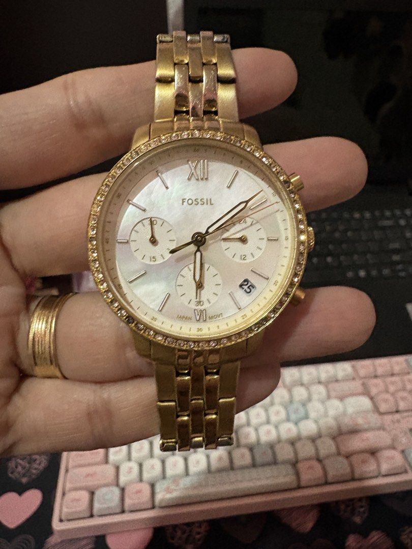 Fossil Gold Chronograph Watch With stones (Category: Women's Watches) located in Quezon City. Submitted by tonijoydeus (Listing ID 1465467857, Image 1). Description: - Brand: Fossil - Color: Gold-tone / quartz - Dial: Mother-of-pearl with chronograph subdials & date window at 4 o'clock - Bezel: Sparkling crystal-embellished bezel - Strap: Metal link bracelet with folding clasp - Inclusions: Original yellow plaid tin case and paperwork - Condition
