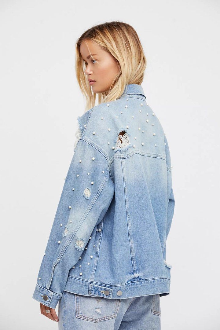 Free People Pearl Soft Denim Jacket (Category: Coats, Jackets and Outerwear) located in Quezon City. Submitted by dropdeadprices (Listing ID 1465502340, Image 3). Description: - Brand: Free People - Size: Large (Oversized boyfriend fit) - Color/Wash: Light blue - Details: All-over faux pearls, distressed shoulders and chest - Pockets: Button chest pockets and lower welt pockets - Condition: Brand new with original $128.00 tag attached.