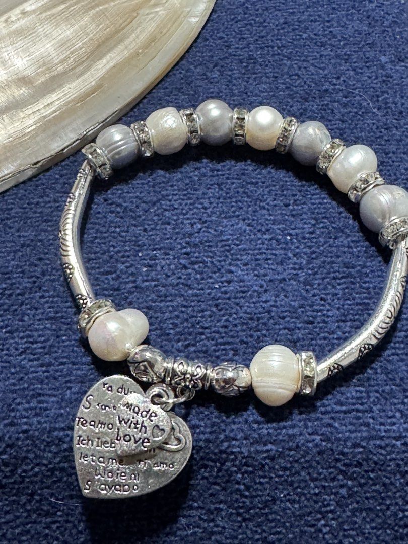 freshwater pearl bracelet (Category: Bracelets) located in Angeles City. Submitted by zyeplustradings (Listing ID 1465503456, Image 2). Description: stretchable freshwater pearl bracelet features alternating gray and white pearls accented with sparkling rhinestone spacers and a sweet heart charm.