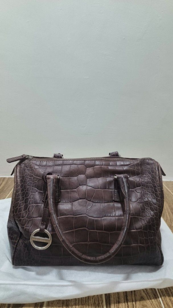 Furla Brown Croc-Embossed Leather Handbag (Category: Luxury Bags & Wallets) located in Pasig City. Submitted by willselleverything.27 (Listing ID 1465486690, Image 1). Description: - Brand: Furla - Color: Dark brown - Material: Genuine croc-embossed leather - Closure: Top zip closure - Handles: Double top handles (with visible wear) - Interior: Light green monogram fabric lining with one zip pocket and metal logo plaque - Inclusion: Original auth