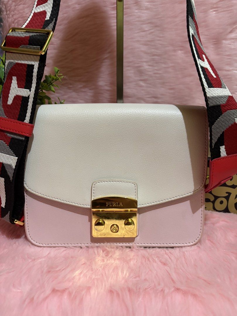 Furla Colorblock Leather Crossbody Bag with Patterned Strap (Category: Cross-body Bags) located in Tuguegarao City. Submitted by closet_jz (Listing ID 1465394021, Image 3). Description: - Brand: Furla - Material: Genuine leather in white and pink with red side panels - Hardware: Gold-tone - Closure: Signature front flap clasp - Strap: Wide, adjustable with a geometric red, white, black, and grey pattern - Condition: Clean interior, structured rec