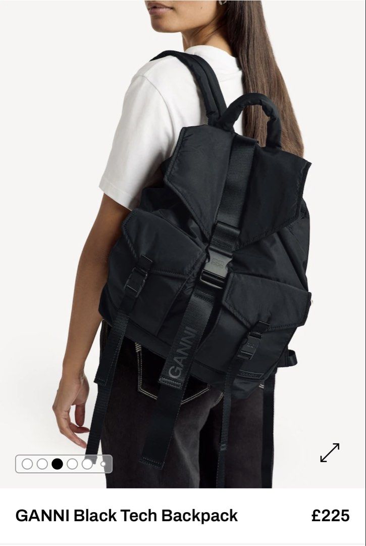 GANNI Recycled Tech Backpack (Category: Backpacks) located in Antipolo. Submitted by minimalistsells (Listing ID 1465540648, Image 1). Description: - Brand: GANNI - Color: Solid Black - Material: Durable nylon with utilitarian hardware - Design: Big center strap with bold branding, minimalist style - Storage: Front pockets with secure buckle closures, great everyday size - Comfort: Top handle and adjustable shoulder straps - Condition: Clean, exc