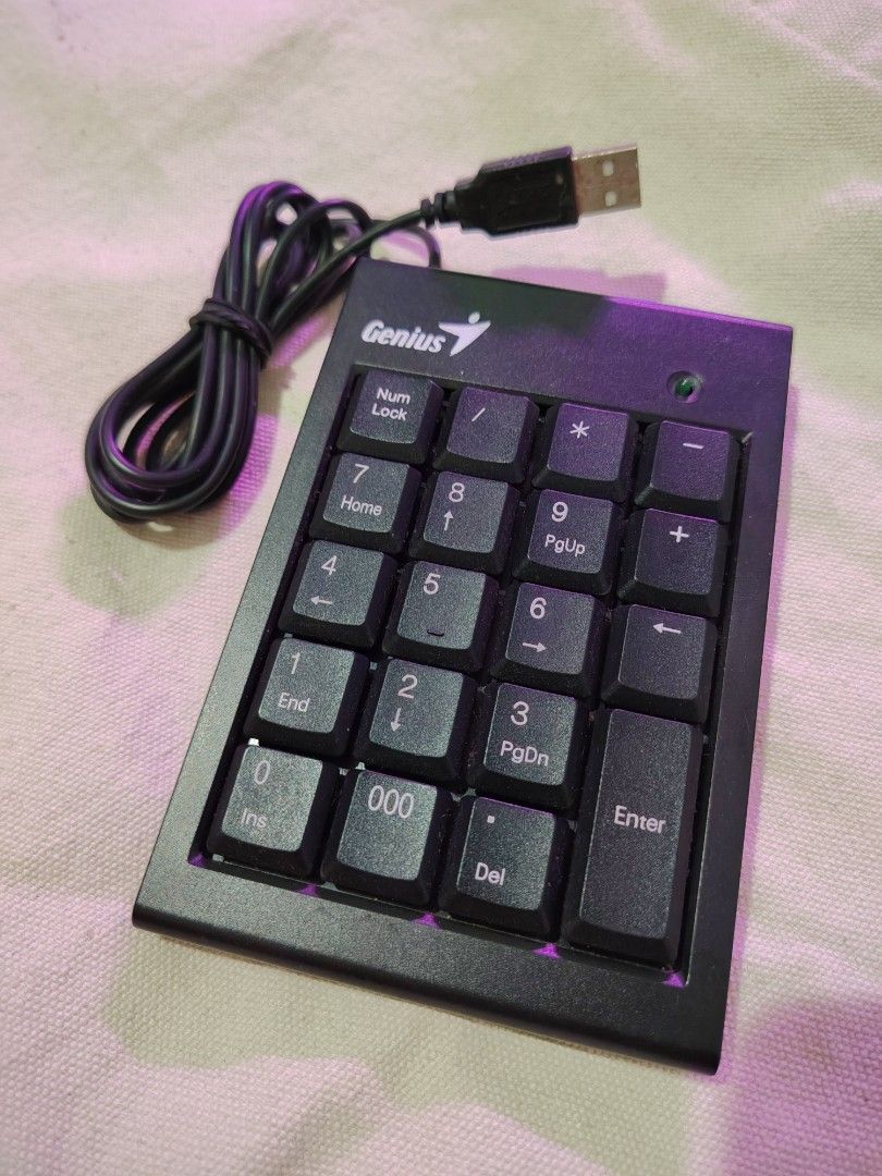 Genius Numpad (Category: Computer Keyboard) located in Mandaluyong City. Submitted by declutter_kween (Listing ID 1465525777, Image 1). Description: - Brand/Model: Genius Numpad 100 wired numeric keypad - Color: Sleek black - Connectivity: Plug-and-play USB cable attached - Layout: Standard layout including Num Lock, Delete, and triple zero (000) keys - Compatibility: Ideal for laptops without a dedicated number pad - Condition: Clean and 100% fu