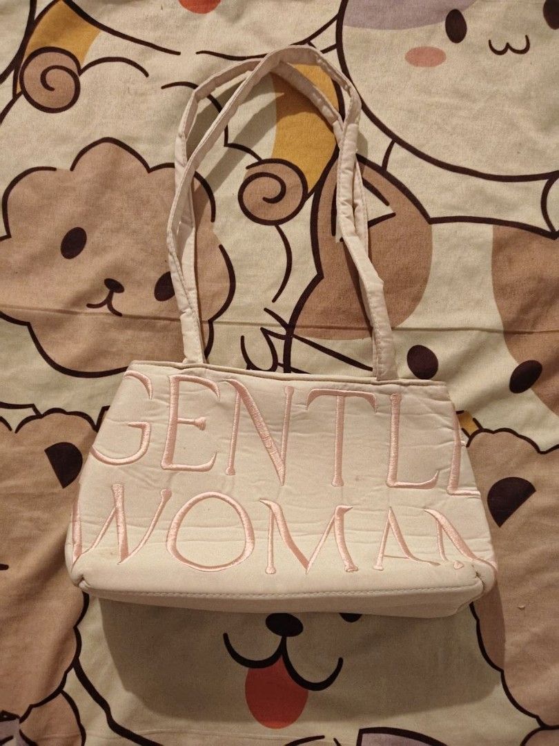 Gentlewoman Pink Embroidered Shoulder Bag (Category: Shoulder Bags) located in Manila. Submitted by ksyoungieberries (Listing ID 1465515230, Image 1). Description: - Color: Cream with pink embroidered Gentlewoman lettering - Material: Soft fabric with a structured base - Straps: Dual shoulder straps for comfortable carrying - Design: Clean, simple, and easy to match with daily outfits - Size: Standard everyday size, fits all your daily essentials