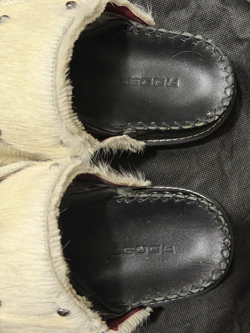 Genuine leather black sandals/mules (Category: Wedges) located in Taguig. Submitted by darjaromanova (Listing ID 1465529081, Image 2). Description: Black genuine leather mule sandals. Includes the original black mule and a removable white faux-fur strap with metal hardware, so you can change the look. Worn only a few times and in very good condition..