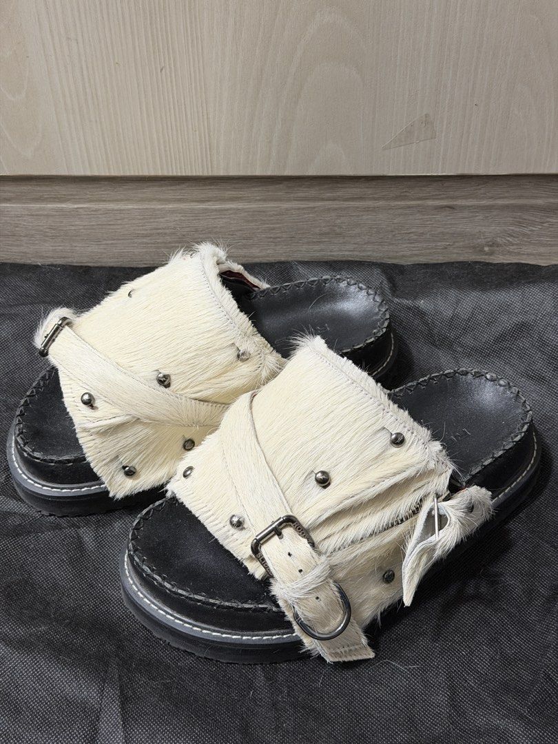 Genuine leather black sandals/mules (Category: Wedges) located in Taguig. Submitted by darjaromanova (Listing ID 1465529081, Image 1). Description: Black genuine leather mule sandals. Includes the original black mule and a removable white faux-fur strap with metal hardware, so you can change the look. Worn only a few times and in very good condition..