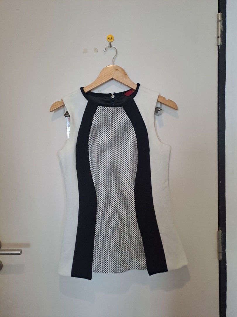 G.I.L.I SLEEVELESS (Category: Undergarments & Loungewear) located in Manila. Submitted by joanbalde39643 (Listing ID 1465442516, Image 1). Description: This sleeveless colorblock top features an hourglass-illusion design with curved black panels framing a textured mesh front section. The exact garment shown is the G.I.L.I. (Got I Love It) Colorblock Sleeveless Top in Black/White/Ivory, which features a fitted silhouette and an exposed back zipper