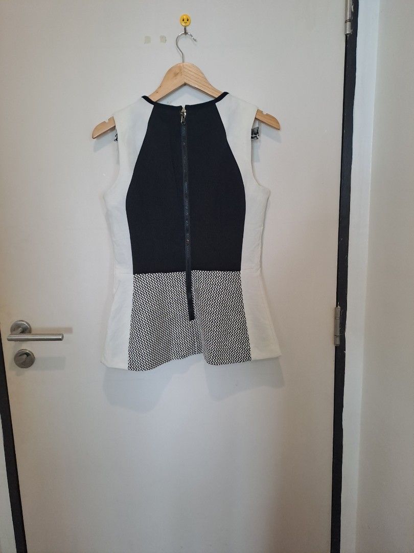 G.I.L.I SLEEVELESS (Category: Undergarments & Loungewear) located in Manila. Submitted by joanbalde39643 (Listing ID 1465442516, Image 3). Description: This sleeveless colorblock top features an hourglass-illusion design with curved black panels framing a textured mesh front section. The exact garment shown is the G.I.L.I. (Got I Love It) Colorblock Sleeveless Top in Black/White/Ivory, which features a fitted silhouette and an exposed back zipper