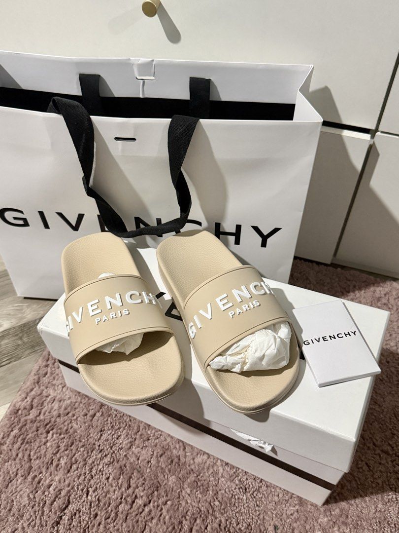 Givenchy Paris Beige Slide Sandals Size 37 (Category: Flats & Sandals) located in Tarlac. Submitted by yernanaythangz (Listing ID 1465415753, Image 2). Description: - Brand: Givenchy - Item: Slide Sandals - Color: Beige with white embossed logo lettering - Size: 37 EU - Material: 100% polyurethane, Made in Italy - Condition: Brand new, never worn, pristine out-of-the-box condition - Features: Slip-on design with a comfortable contoured footbed - 