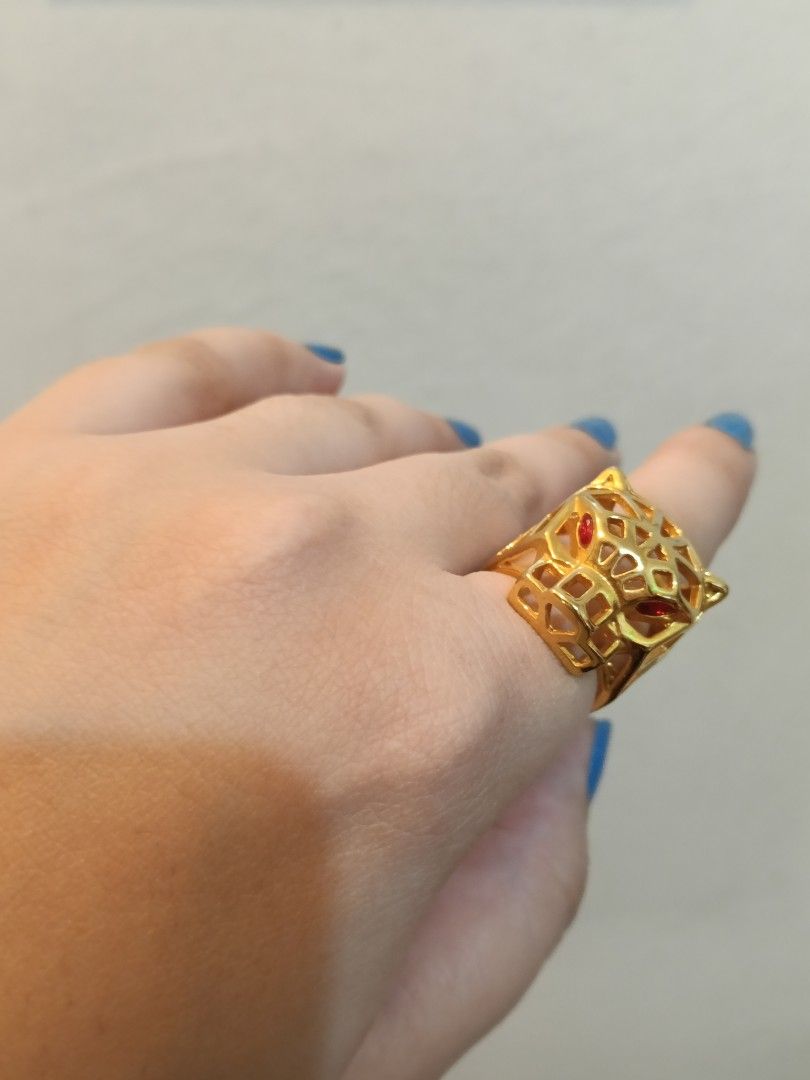Gold Panther Ring with Red Gemstone Eyes (Category: Rings) located in Manila. Submitted by dearsunnystore (Listing ID 1465550397, Image 1). Description: - Statement ring featuring a striking panther head design - Luxurious gold-tone finish with a modern geometric cut-out pattern - Eye-catching bright red stones set securely into the eye sockets - Chunky style that adds a bold touch to any outfit - Perfect accessory to elevate your everyday or eve
