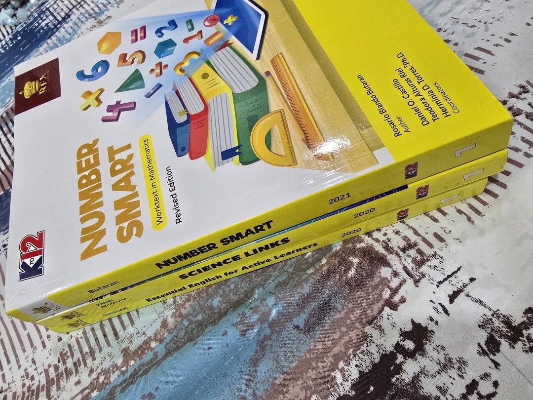 Grade 1 K to 12 Worktexts Set Mathematics Science English (Category: Textbooks) located in Cavite. Submitted by justforthrift (Listing ID 1465423640, Image 1). Description: 250 each book. Bundle of three Grade 1 worktexts from Rex Education. Includes Number Smart in Mathematics, Science Links, and Essential English for Active Learners. Covers core subjects for early elementary students. Clean pages, no writings inside. Published between 2020 and 