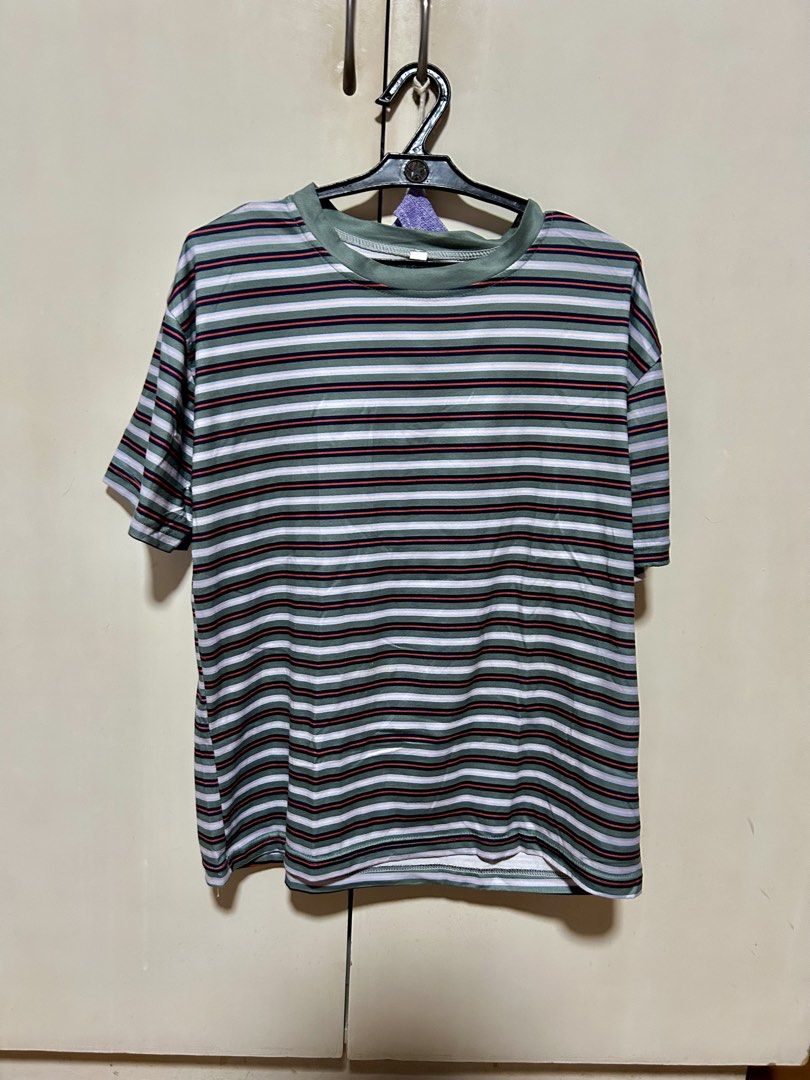 Green Striped Crew Neck T-Shirt (Category: Shirts) located in Makati City. Submitted by monicavazquez (Listing ID 1465485651, Image 1). Description: - Color: Green with multi-color horizontal stripes - Fit: Relaxed fit with standard crew neckline - Material: Soft, breathable cotton-poly blend - Style: Casual daily wear, pairs easily with jeans or shorts - Condition: Brand new / Excellent.