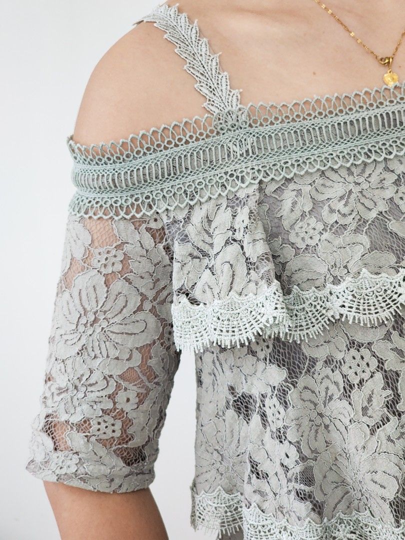 grey lace tiered ruffled cold shoulder top (Category: Sleeveless) located in Batangas. Submitted by curatedbylisilaloop (Listing ID 1465432171, Image 2). Description: AONE | grey lace tiered ruffled cold shoulder top Size: XS-S Bust: 36".