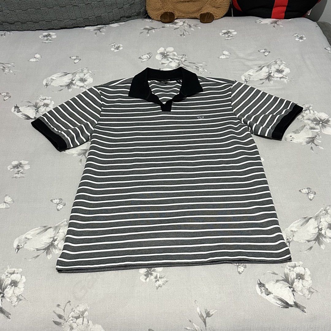 Grey White Striped Polo Shirt Black Collar (Category: Tshirts & Polo Shirts ) located in Lipa City. Submitted by jecoparra (Listing ID 1465512349, Image 1). Description: - Grey and white horizontal striped short sleeve polo shirt - Contrasting solid black collar and sleeve cuffs - Small embroidered logo on the chest - Classic button placket neckline - Regular fit in breathable cotton knit fabric - Great for everyday casual wear.