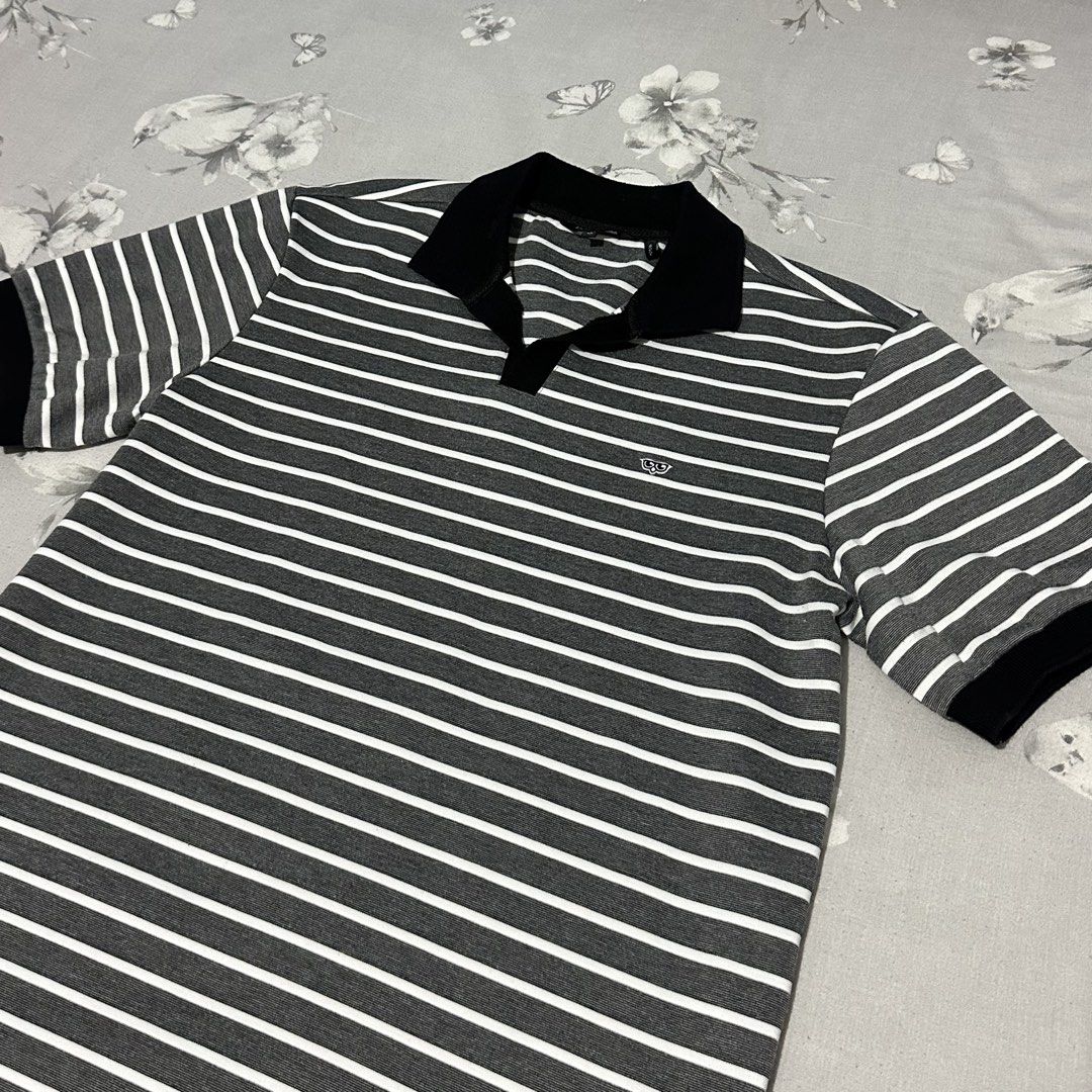 Grey White Striped Polo Shirt Black Collar (Category: Tshirts & Polo Shirts ) located in Lipa City. Submitted by jecoparra (Listing ID 1465512349, Image 2). Description: - Grey and white horizontal striped short sleeve polo shirt - Contrasting solid black collar and sleeve cuffs - Small embroidered logo on the chest - Classic button placket neckline - Regular fit in breathable cotton knit fabric - Great for everyday casual wear.