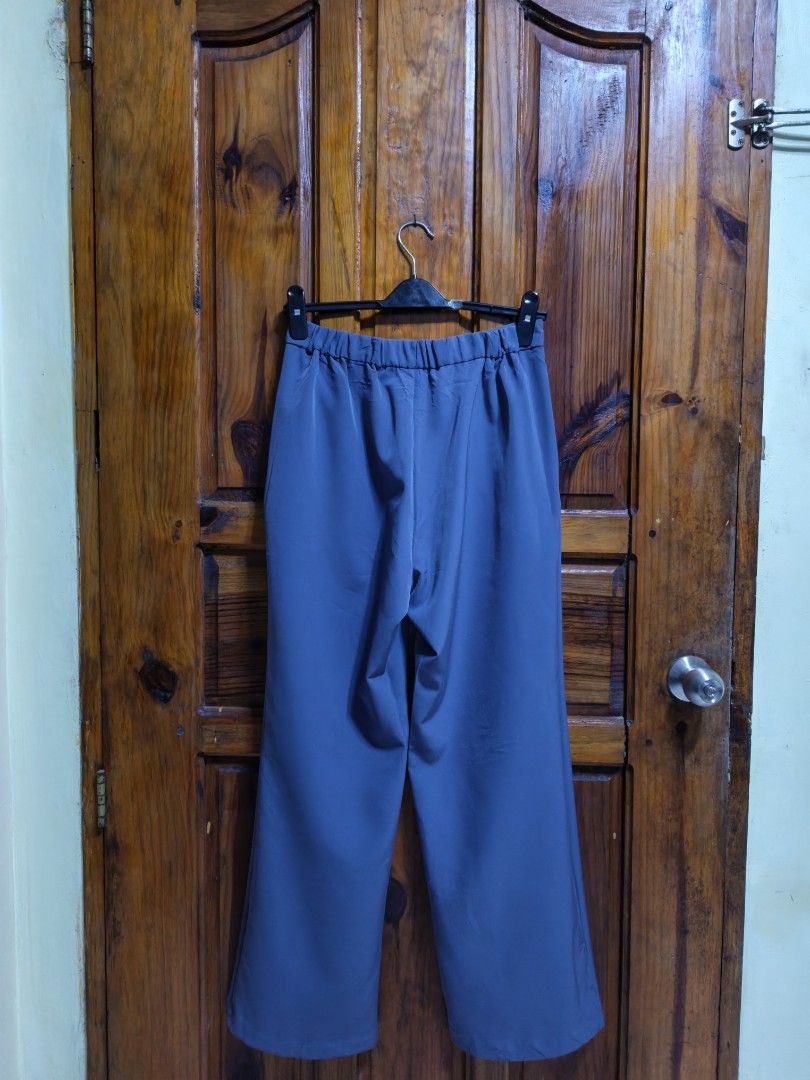 GU Blue straight cut Leg Pants Size L (Category: Jeans) located in Baguio. Submitted by jbv.ph (Listing ID 1465573469, Image 3). Description: - Brand: GU - Style: Wide leg pants - Color: Blue - Size: L (Brand new with tag attached) - Material: 90% polyester, 10% polyurethane - Features: Flat front design, elastic waistband at the back, functional side pockets - Condition: Clean, flawless, and great for everyday wear.