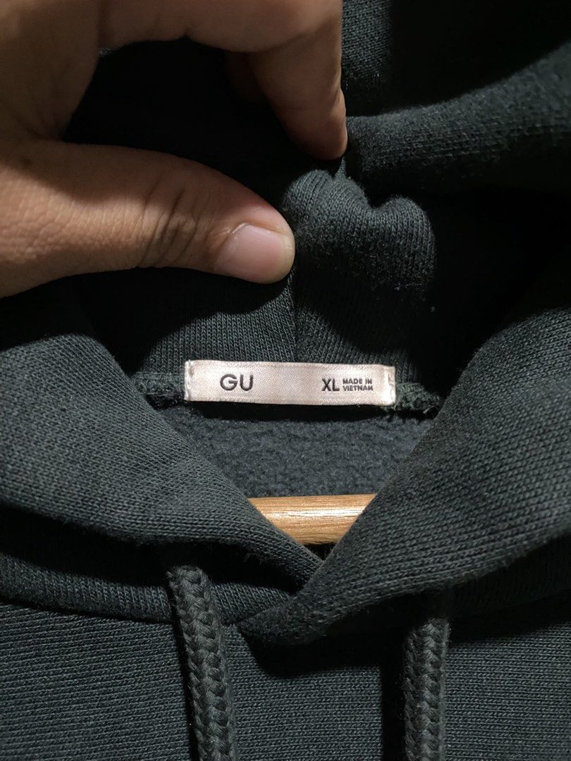GU Dark Green Hoodie (Category: Coats, Jackets and Outerwear) located in Antipolo. Submitted by cogiestamaria (Listing ID 1465426440, Image 3). Description: - Brand/Model: GU Hoodie - Color: Dark Green - Size: XL - dimes W25-L28 - No issue - Color rate 10-10 - Good as new - Material: 80% Cotton, 20% Polyester (Made in Vietnam) - Features: Heavyweight fabric, cozy fleece lining, front kangaroo pocket, and adjustable drawstring hood - Fit: Ribbed c