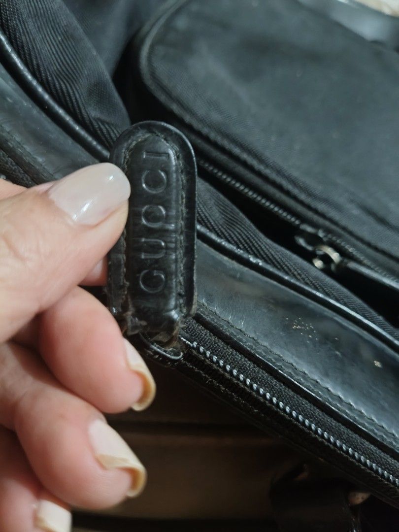 Gucci Black Bamboo Backpack (Category: Backpacks) located in Bulacan. Submitted by aichang21 (Listing ID 1465496848, Image 3). Description: - 100% Authentic Gucci backpack in black nylon and leather - Signature real bamboo top handle - Single adjustable leather strap with metal hardware - Front zip pocket and secure main compartment - Gucci monogram fabric interior lining with "Made In Italy" leather label - Features Gucci-embossed zipper pulls.