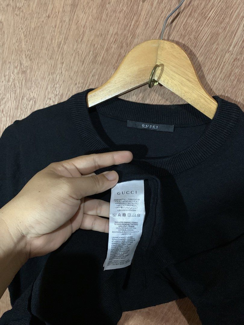 Gucci Black Bee Crown Sweater (Category: Networking) located in Tacurong. Submitted by ljsthrift (Listing ID 1465463104, Image 2). Description: - Gucci short-sleeve knit sweater in timeless black - 100% premium cotton fabric, crafted in Italy - Features a signature embroidered bee and crown design on the chest - Classic crew neck with clean ribbed trim - Original Gucci neck tag and care labels attached - Excellent, clean condition.