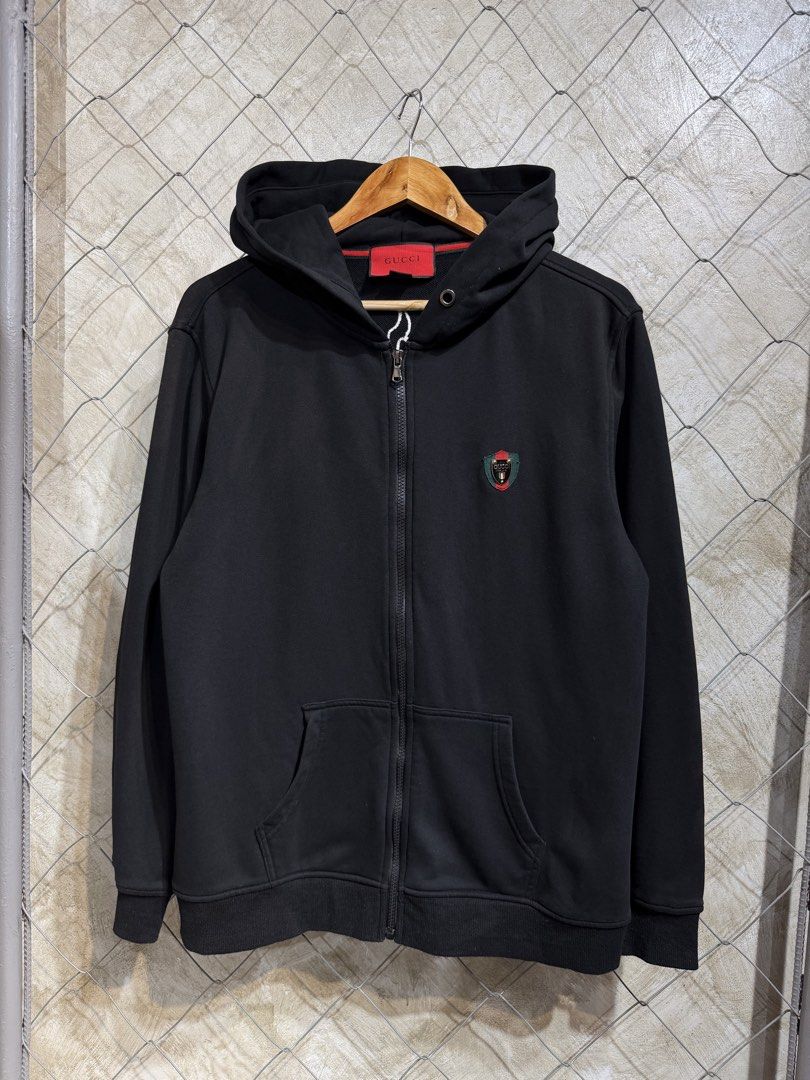 Gucci Black Hoodie. (Category: Coats, Jackets and Outerwear) located in Manila. Submitted by ardobe.mnl (Listing ID 1465535473, Image 1). Description: Size: Medium Dimes: 21.5x26.5 Condition: Excellent Flaw: Unnoticeable Fadings, check last 3 photo. (Black na black pa sya) Dm for inquiries! 📥.