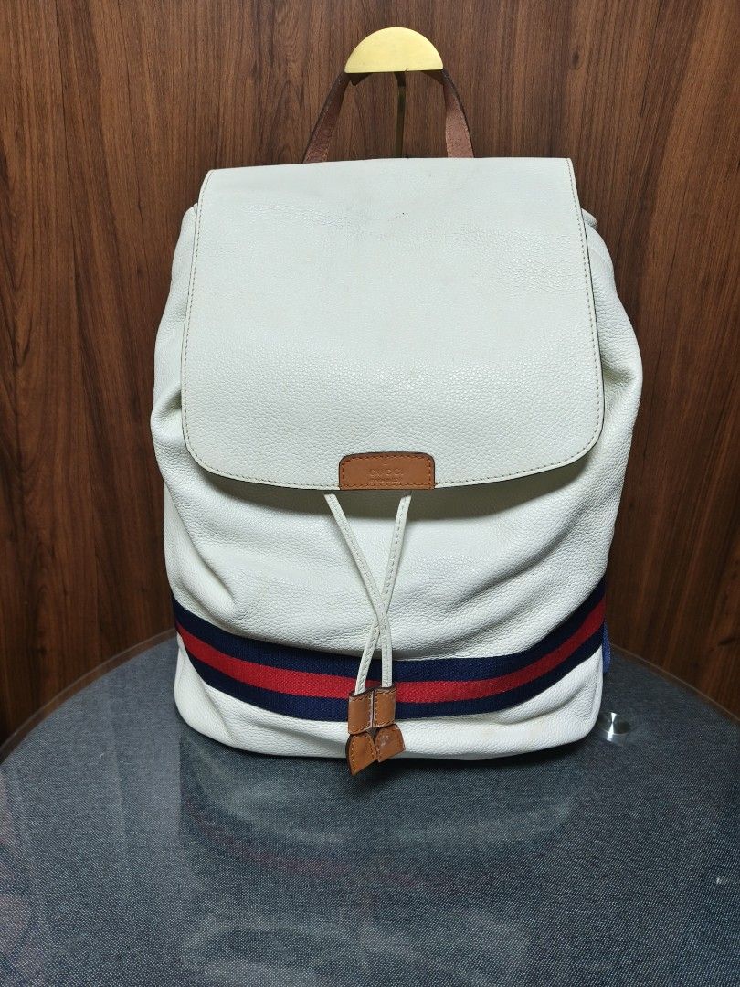Gucci Classic White Leather Web Stripe Drawstring Backpack (Category: Luxury Bags & Wallets) located in Baguio. Submitted by PreiLoveMaria (Listing ID 1465530597, Image 2). Description: Classic Gucci White Leather Web Stripe Drawstring Backpack ​ Crafted from supple white pebbled leather and highlighted with the iconic blue-and-red Web stripe, it blends high-end style with effortless everyday functionality. Complete with adjustable canvas shoulde
