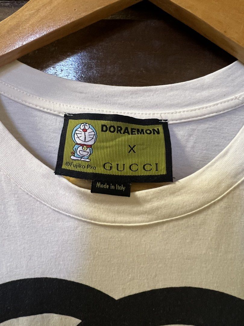 Gucci Daraemon with complete tags (Category: Shirts) located in Tarlac. Submitted by royal.ching (Listing ID 1465393566, Image 3). Description: ✨ FOR SALE: Doraemon x Gucci T-Shirt ✨ Looking to elevate your streetwear game? I am selling this iconic Doraemon x Gucci white graphic t-shirt. Highly sought-after collaboration piece that perfectly blends luxury fashion with classic anime nostalgia! • 🏷️ Condition: Used, but good as new. It has been me