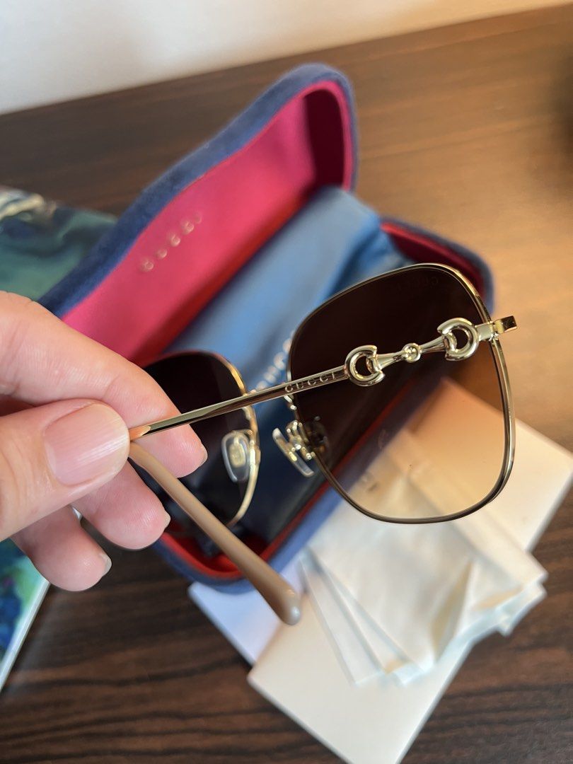 Gucci Horsebit Square Sunglasses Gold Brown Gradient (Category: Sunglasses & Eyewear) located in Makati City. Submitted by ciriacoria (Listing ID 1465445920, Image 3). Description: - Brand: Gucci Square Sunglasses - Color: Gold-tone metal with light beige acetate temple tips - Lenses: Brown gradient (clean, zero scratches) - Special Feature: Iconic horsebit detail along the temples - Inclusions: Original velvet hard case, satin pouch, and cleanin