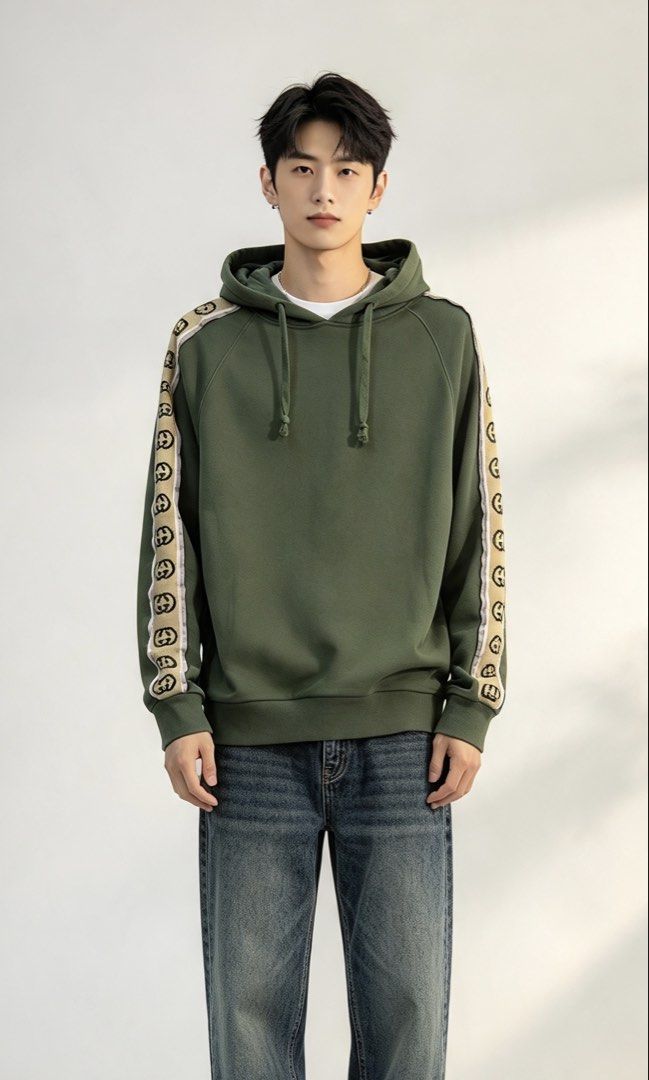 Gucci Interlocking G Olive Green Hoodie Size M (Category: Coats, Jackets and Outerwear) located in Paranaque City. Submitted by preluxeshop_ph (Listing ID 1465555586, Image 1). Description: Gucci Interlocking G Olive Green Hoodie Size M - Size: Medium (Made in Italy) - Cream and black jacquard stripe tape with interlocking G logo on both sleeves - Premium cotton loopback fleece fabric - Drawstring hood with ribbed cuffs and hem - Clean piece with