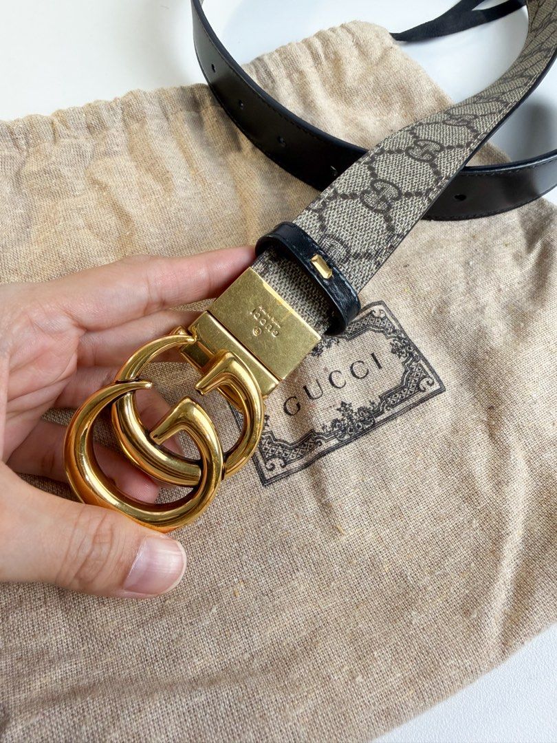 Gucci Reversible GG Supreme Monogram Leather Belt (Category: Luxury Accessories) located in Mandaluyong City. Submitted by a.m.closet (Listing ID 1465533857, Image 2). Description: - Brand: Gucci - Style: Reversible UNISEX Belt (2 looks in 1) - Material: GG Supreme Canvas / Smooth Black Leather - Hardware: Shiny gold-tone interlocking G buckle - Size: 80-32 - Style Number: 659417 92TIC 525040 - Inclusions: Original dust bag - Condition: Great pre