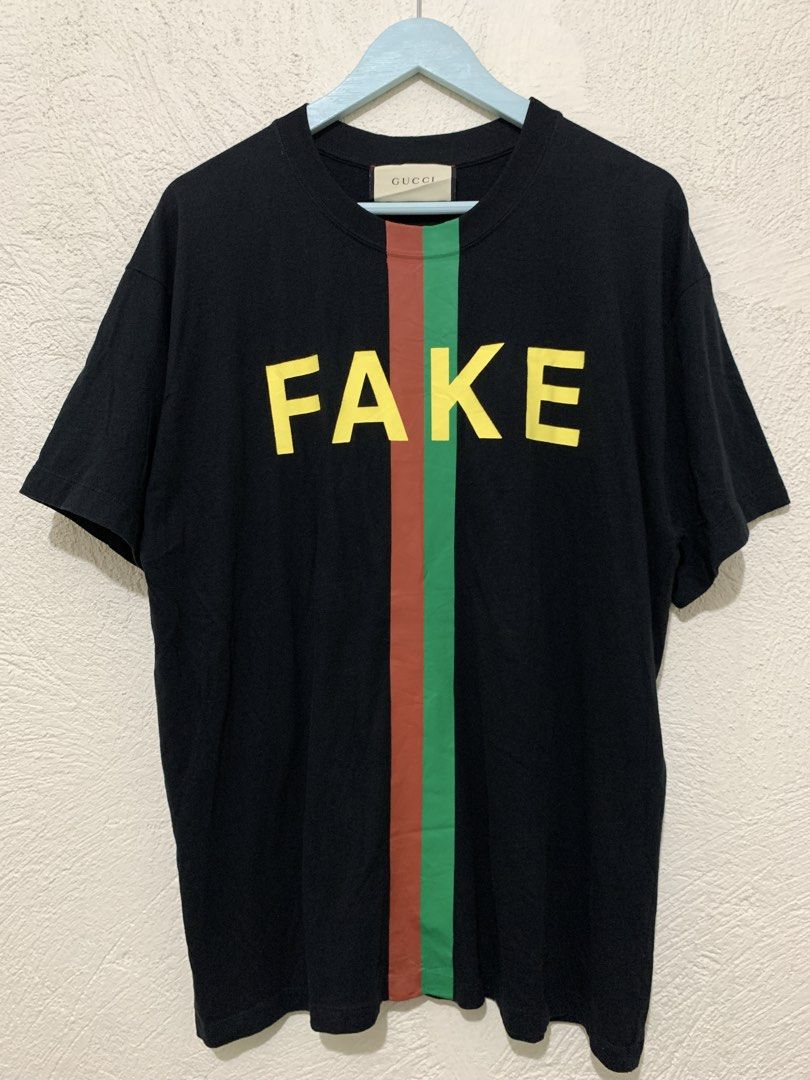 Gucci T-Shirt (Category: Tshirts & Polo Shirts ) located in Tiaong. Submitted by nycko.concha (Listing ID 1465432379, Image 2). Description: GUCCI “NOT FAKE” Logo T-Shirt Chest: 22 in Length: 29 in Shoulder: 20 in Sleeve: 8 in Condition: Gently Used Issue: Proper wash Color rate: 95% Note: All used items have been previously worn and may show some signs of previous wear. And color may still vary due to lighting..