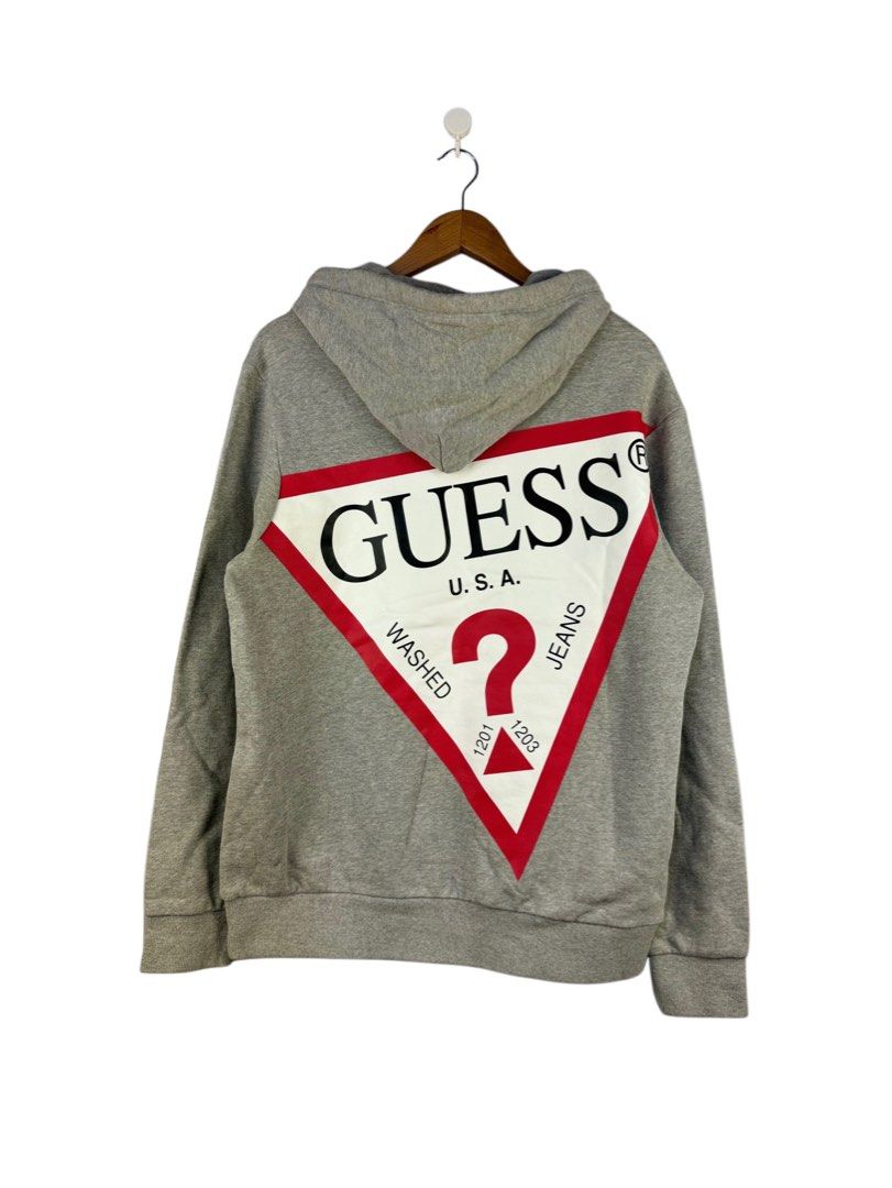Guess Grey Hoodie with Large Back Logo Size L (Category: Hoodies) located in Caloocan City. Submitted by mzcollection_349 (Listing ID 1465415477, Image 2). Description: - Brand: Guess - Color: Grey - Material: 100% Cotton - Size: Large (Actual measurement: 22 x 27 inches) - Design: Small chest logo & huge Guess triangle logo on the back - Features: Front kangaroo pocket & black hood drawstrings - Condition: Good as new / Excellent pre-loved condi