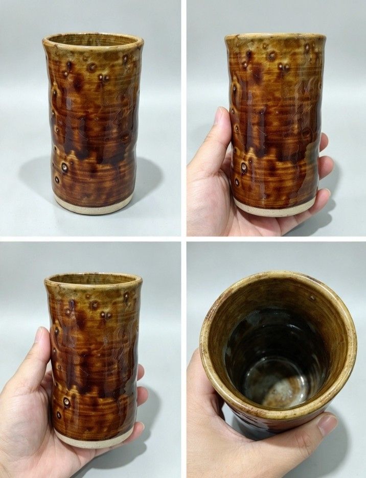 Handmade Glazed Ceramic Tumbler Brown Coffee Cup (Category: Coffee & Tea Tableware) located in Baguio. Submitted by akileshomeprints (Listing ID 1465467435, Image 1). Description: Handmade ceramic tumbler featuring a rich brown drip glaze and comfortable ergonomic indents. Sturdy, unique, and perfect for your daily coffee or tea. Japan surplus .