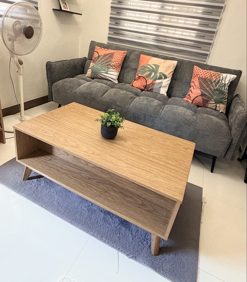 Haru Coffee Center Table (Category: Tables & Sets) located in Batangas. Submitted by belaluz09 (Listing ID 1465426719, Image 3). Description: - Model: Haru Coffee Center Table - Finish: Light oak - Design: Slatted sliding door with open storage shelf - Style: Mid-century modern with clean tapered wooden legs - Material: Sturdy particle board construction - Perfect for living rooms and daily use Please see all photos to appreciate slightly negotia