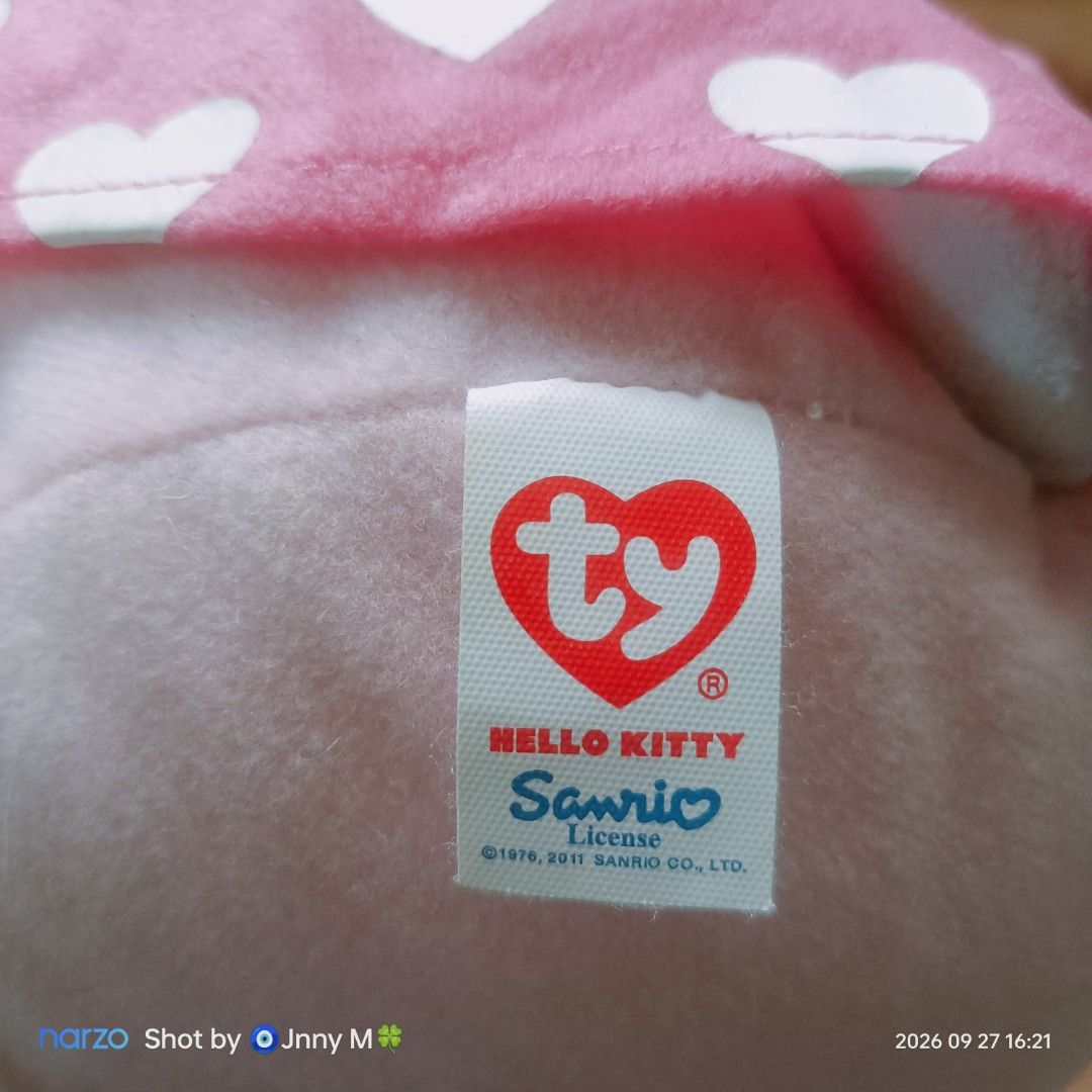Hello Kitty Ty Sanrio Plush Toy (Category: Plushies & Soft Toys) located in Taguig. Submitted by mhayestufftoys (Listing ID 1465436301, Image 2). Description: - Official Sanrio licensed Kitty plush by Ty (2011) - Soft white plush body with clean, fluffy filling - Detailed with black embroidered eyes and a yellow nose - Wears a charming pink dress and matching bow with white hearts - Original tag securely attached, perfect for collectors - From a 