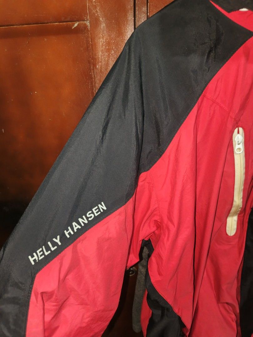 Helly Hansen Helly Tech Waterproof Hooded Jacket Red Black XL (Category: Coats, Jackets and Outerwear) located in Saravia. Submitted by foundandfavedbcd (Listing ID 1465533197, Image 3). Description: - Brand: Helly Hansen - Style: Waterproof hooded jacket - Colorway: Red and black - Size: XL - Technology: Helly Tech fabric - Features: Full zip front, dual chest zip pockets, adjustable drawstrings on hood, velcro adjustable cuffs, mesh inner linin