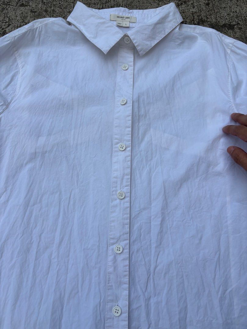 Helmut Lang White Long Sleeve Button Down Shirt Size L (Category: Longsleeves) located in San Pedro. Submitted by wharfthrift (Listing ID 1465444633, Image 3). Description: FOR SALE ‼️ Helmut Lang White Long Sleeve Button Down Shirt Size L GOOD CONDITION 9/10 ISSUE minimal stain check last photos (removable) SIZE 20 width 25 front length 27 back length 25 sleeves ₱3,000 + SF shipping via lalamove or j&t meet up around san pedro laguna or muntinlu