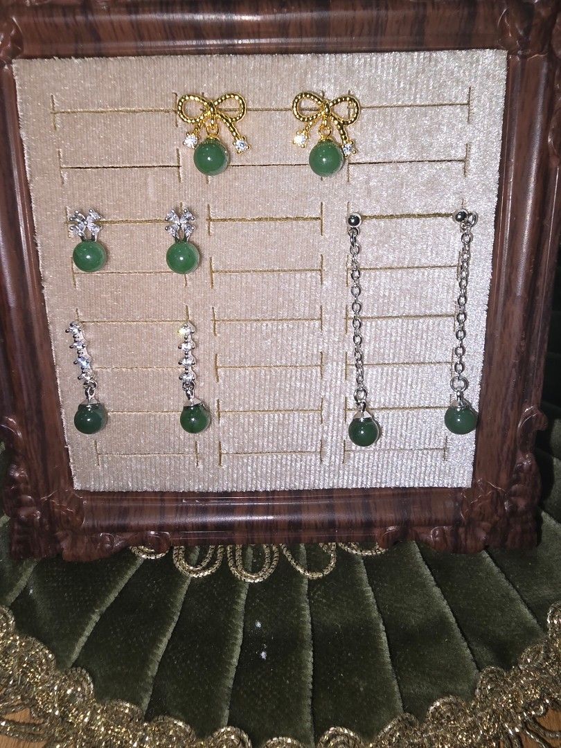 Hetian Jade stud & dangling earrings bundle (Category: Earrings) located in Santa Rosa. Submitted by crystal1.0 (Listing ID 1465482840, Image 1). Description: - 4 unique pairs of green jade earrings - Includes gold-tone bows, silver-tone drop chains, and crystal studs - Features dark green round beads on every pair - Comes with a free velvet display tray - Versatile styles for daily wear or gifting - Brand new and ready to ship.