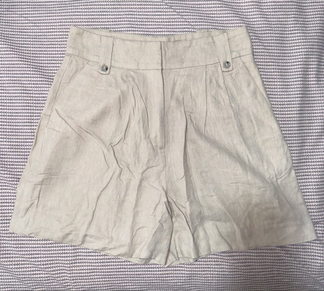 H&M Beige Linen Blend Shorts Size US 4 (Category: Shorts) located in Santa Ana. Submitted by fatikilla (Listing ID 1465432339, Image 1). Description: - Brand: H&M - Size: US 4 / EUR 36 - Color: Classic Beige - Material: Breathable linen blend - Fit: High-waisted with front pleats and belt loops - Details: Zipper fly, button closure, and back welt pockets - Condition: Excellent, clean fabric with no major wear.