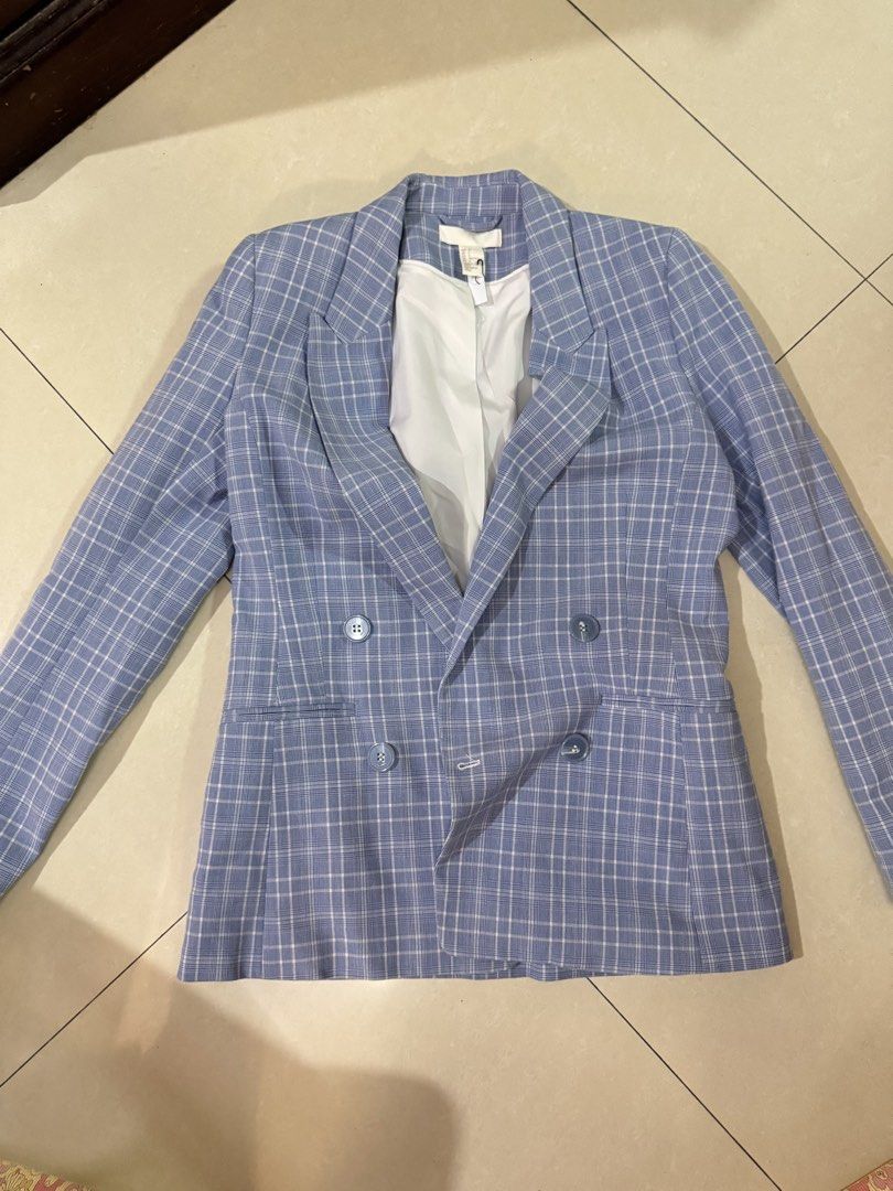 H&M Blue Plaid Double Breasted Blazer (Category: Coats, Jackets and Outerwear) located in Quezon City. Submitted by sweetlyluxe (Listing ID 1465494007, Image 1). Description: - Brand: H&M - Style: Double-breasted blazer with lapel collar and structured shoulders - Size: EUR 32, US 2 - Color/Pattern: Clean blue and white plaid - Features: White inner lining, four front buttons, two functional side pockets - Condition: Clean and well-maintained.