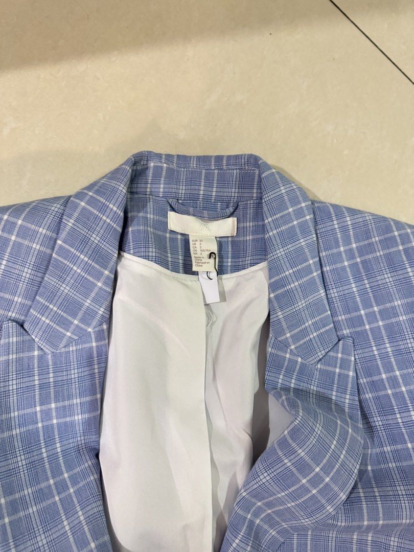 H&M Blue Plaid Double Breasted Blazer (Category: Coats, Jackets and Outerwear) located in Quezon City. Submitted by sweetlyluxe (Listing ID 1465494007, Image 2). Description: - Brand: H&M - Style: Double-breasted blazer with lapel collar and structured shoulders - Size: EUR 32, US 2 - Color/Pattern: Clean blue and white plaid - Features: White inner lining, four front buttons, two functional side pockets - Condition: Clean and well-maintained.