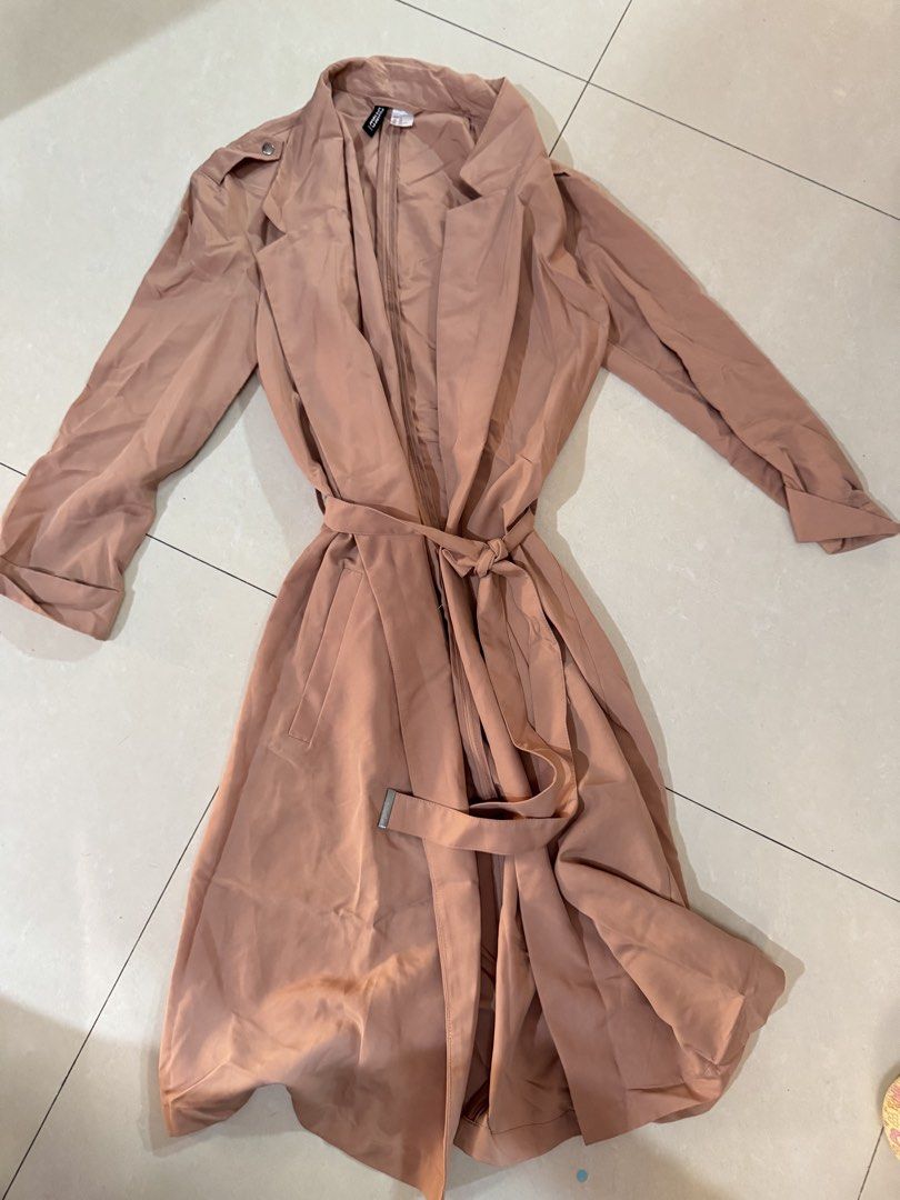 H&M Divided Brownish Pink Trench Coat (Category: Coats, Jackets and Outerwear) located in Quezon City. Submitted by sweetlyluxe (Listing ID 1465498060, Image 1). Description: - Brand: H&M Divided - Size: XS - Color: Pinkosh brown like terracotta - Material: Lightweight fabric, perfect for layering - Features: Open front with lapels, tied waist with matching belt, functional side pockets - Condition: Clean and ready to wear for work, office, trave