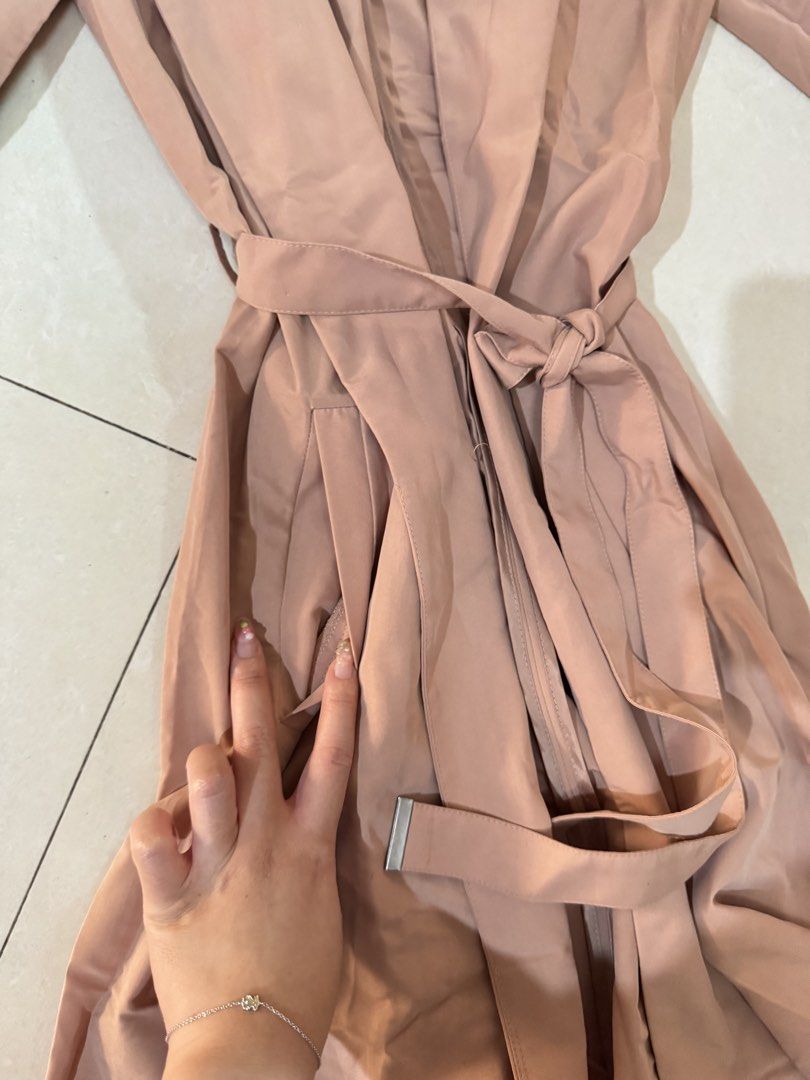 H&M Divided Brownish Pink Trench Coat (Category: Coats, Jackets and Outerwear) located in Quezon City. Submitted by sweetlyluxe (Listing ID 1465498060, Image 3). Description: - Brand: H&M Divided - Size: XS - Color: Pinkosh brown like terracotta - Material: Lightweight fabric, perfect for layering - Features: Open front with lapels, tied waist with matching belt, functional side pockets - Condition: Clean and ready to wear for work, office, trave